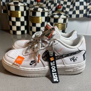 Nike Air Force 1 White and Black Sneakers with Orange Accent